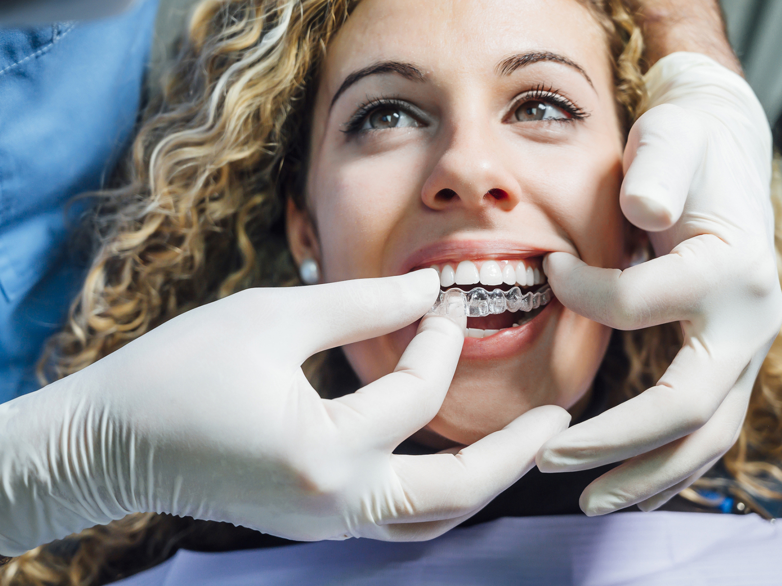 Do you have to brush before putting Invisalign back in?