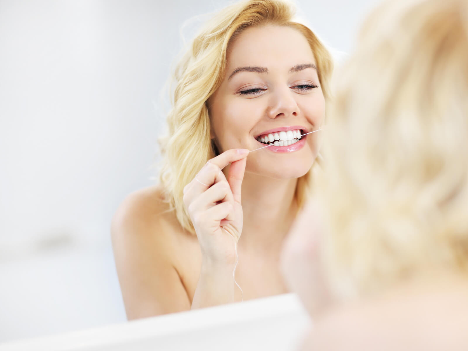 Why Flossing Is Just As Important As Brushing